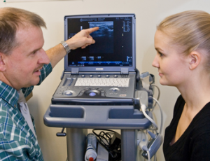 Doctor reviews the results of an ultrasound with patient